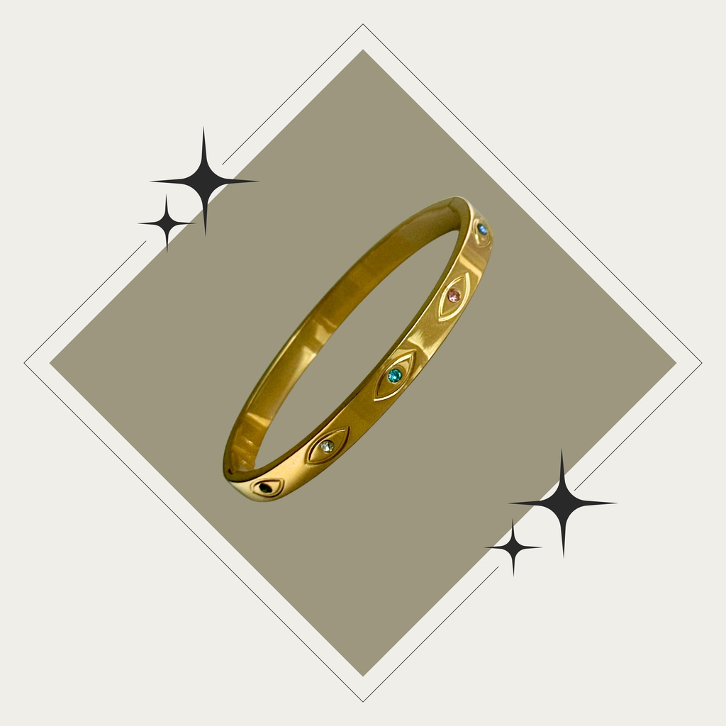 Bangle oro con ojos y zirconias en colores Stainless Steel