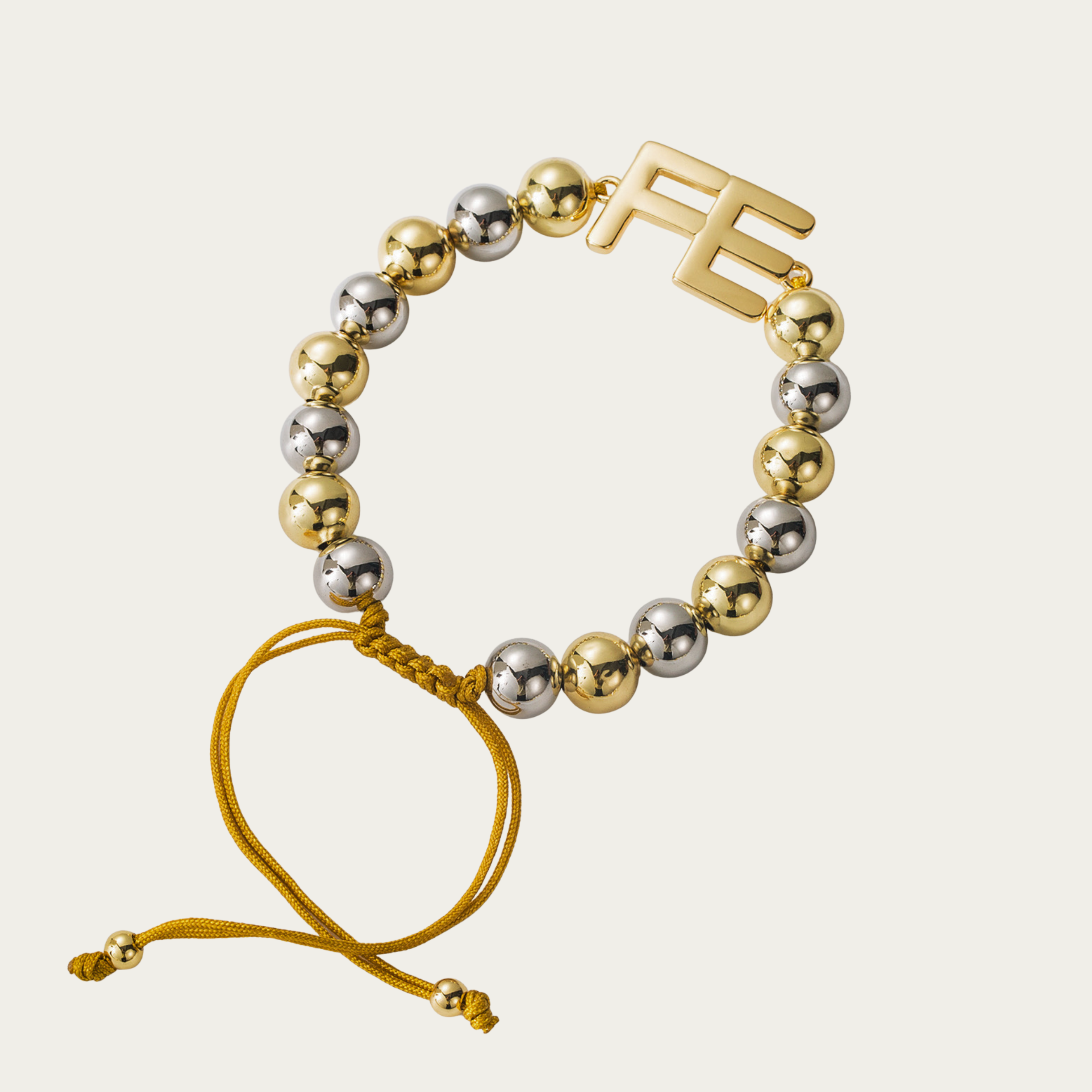 Pulsera de hilo ajustable con balines doble tono y FE