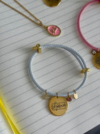 Pulsera blanca ELEGIDA oro (ajustable)