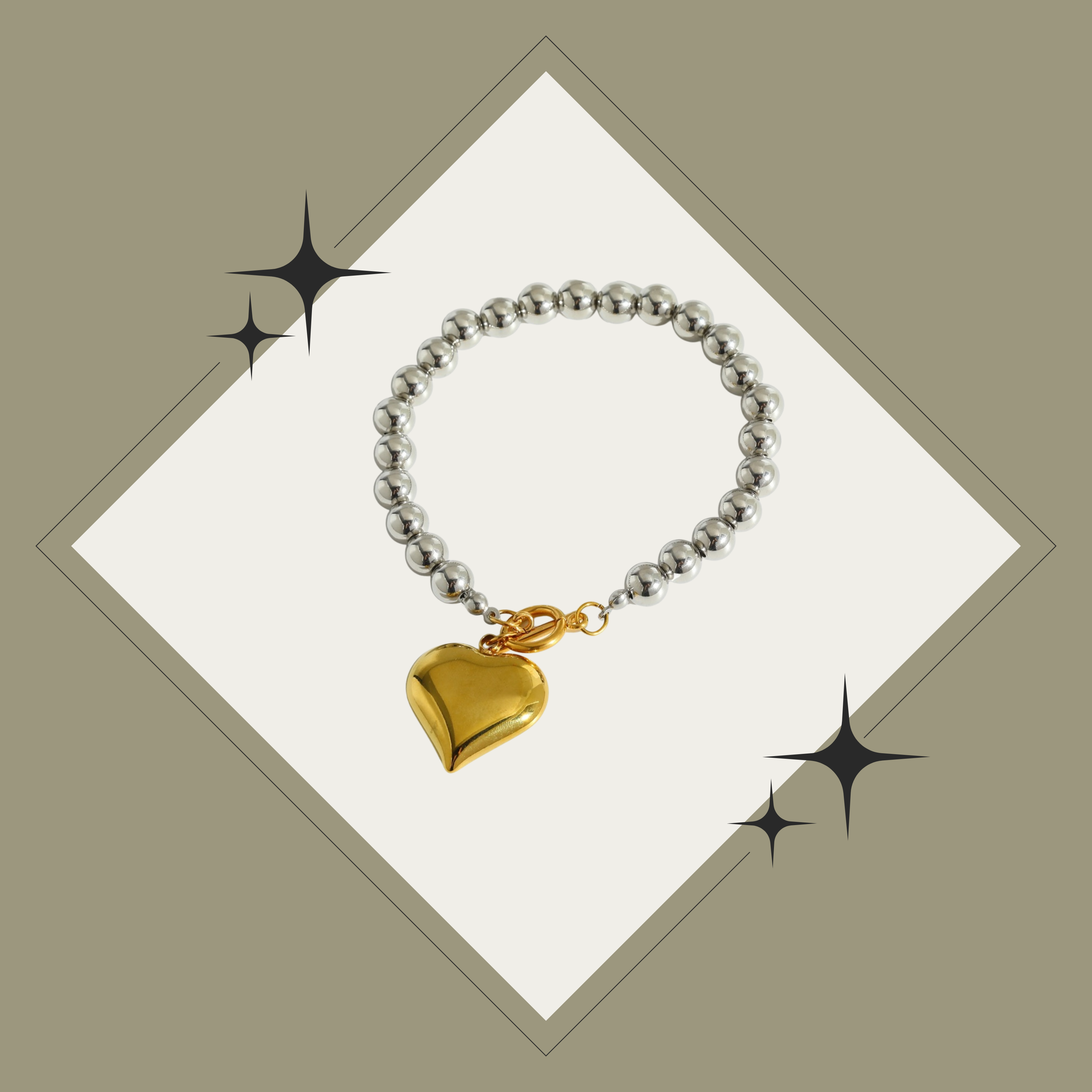 Pulsera de balines plata con corazón oro