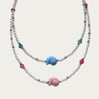 Collar de perlas con caracol rosa o azul
